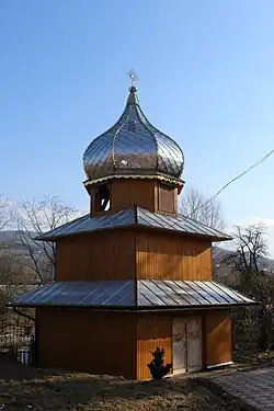 Two-story wooden bell tower from the 18th century in the village of Mshanets.