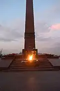 The eternal flame at the memorial in the night time