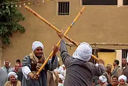 Egyptians performing tahtib, a traditional martial art