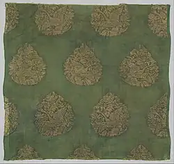 Plain-weave silk brocaded with gold-leaf-wrapped leather strips, Jin dynasty.