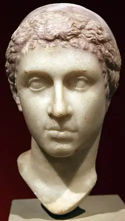 Cleopatra, mid-1st century BC, showing Cleopatra with a "melon" hairstyle and Hellenistic royal diadem worn over the head, now in the Altes Museum[1][3][433]