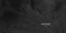 Close view of the central section of Auki Crater showing ridges with arrow Image is an enlargement of a previous HiRISE image.