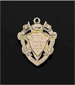 A medal inscribed with "Carlton Football Club, V.F.L. Premiers 1907"