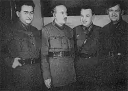 Four men in uniform