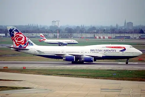 747 in "Utopia" livery and Chelsea Rose tail art (photo from 2002, livery used 1997–2006)