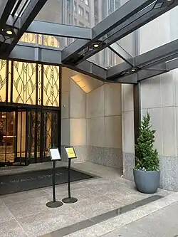 An entrance to 1 Wall Street's annex, with a glass canopy over it. The entrance is reserved for the building's residents; the general public cannot use it.
