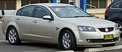 Front-three-quarters view of a gold-coloured sedan