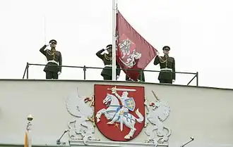 The presidential version of the coat of arms, as depicted on the Presidential Palace, and the flag of the president of Lithuania