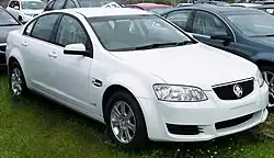 Front-three-quarters view of a white-coloured sedan