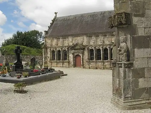 View of the Pencran ossuary with the triangular pediment over the entrance and ionic pillars on either side of each of the six windows