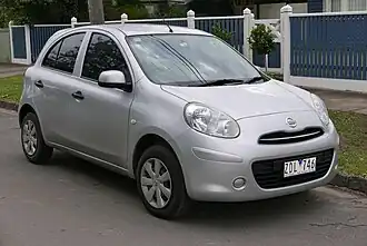 A small five-door car with hubcaps over steel wheels