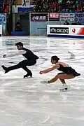 Side-by-side sit spins (Nicole Della Monica & Matteo Guarise)