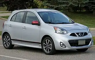 A small, silver five-door car