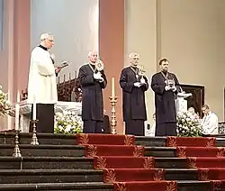 Three small reliquaries being shown