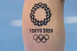 An Olympic tattoo on the calf of handball player Larissa Araújo