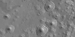 Close view of expanded craters, as seen by HiRISE After the impact, ice left the ground and made the crater larger in diameter.