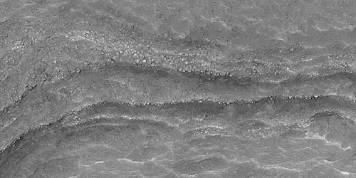 Close view of layers, as seen by HiRISE under HiWish program. Some of the layers are breaking up into large blocks.