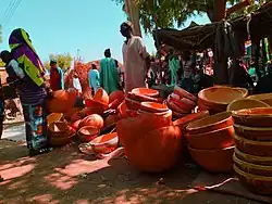 A Fulani Woman buying a Calabash in the Kolere market, Fune, Yobe State
