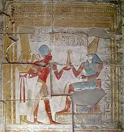 Relief in the temple of Seti I of Seti I wearing the Khepresh while presenting an offering to Horus
