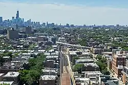 Aerial view of Red-Purple Bypass construction, featuring construction on the main line and the new flyover ramp