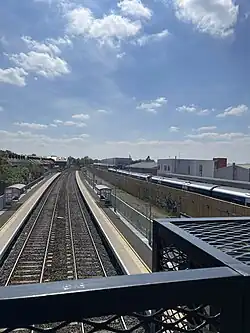 An Overview of the Dublin-Belfast Mainline with Adelaide station in the foreground with the train maintenance depot at Adelaide in the Background