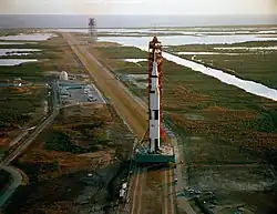 A large rocket being moved by crawler