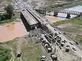 Aerial view of the erection site of a Medium Girder Bridge over the Kazer River, Mosul, Iraq, 2003.
