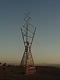 Dissipate, an hourglass tower art sculpture including tensegrity structure, constructed at AfrikaBurn, 2015, a Burning Man regional event