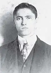 Black and white front-facing photo of Batson in a suit