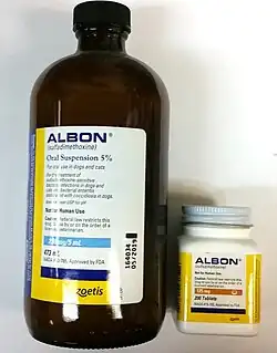 On the left, a large amber bottle of labeled, "Albon (sulfadimethoxine): Oral suspension 5%". On the right, a bottle of Albon pills (125 mg, 200-count)