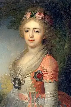 Young woman wearing a white dress with a light blue belt and coat. A miniature of a woman hangs in her neck, and she's wearing the badge of the Order of Saint Catherine on her chest. Her long and curly hair is powdered with a wreath of roses in it.