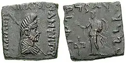 Indian-standard coin of Amyntas, with obverse showing the bust of Zeus-Mitra wearing a phrygian cap, and surrounding Greek legend. The reverse showing standing Athena in armour and with surrounding Kharoshti legend.