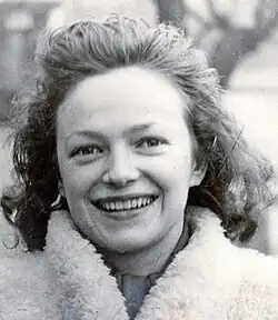 Photo of Andrée Dumon wearing a fur coat