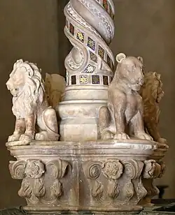 Lions and a lioness at a pinnacle of the balustrade