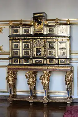 Baroque caryatids of a cabinet, c. 1675, ebony, kingwood, marquetry of hard stones, gilt bronze, pewter, glass, tinted mirror and horn, Museum of Decorative Art, Strasbourg, France[22]