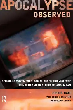 Orange cover with a sideways TV showing buildings burning during the Waco siege