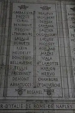 Photograph shows two columns of French names etched in stone.