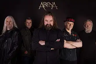 Arena in 2024. L-R: Clive Nolan, John Mitchell, Damian Wilson, Kylan Amos, and Mick Pointer.