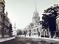 19th century photograph of the High Street looking west with University College on the left and the spires of the University Church of St Mary the Virgin and All Saints Church in the distance
