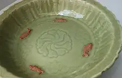 dish with sprigged fish in biscuit, and effects from glaze collecting in the incised decoration, Yuan, 14th century
