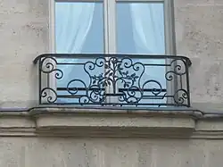 Balcony with elm symbol, overlooking the 'Crossroads of the Elm', Place Saint-Gervais, Paris[95]