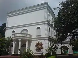 Broad semicircular carriage veranda with stairs in front of Burdwan House.