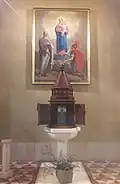 The baptismal font of Saint Bartholmew parish church in Marne, Italy
