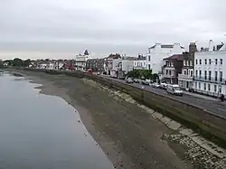 Road in front of houses by a beach