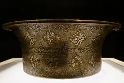 Basin made by Ahmad al-Dhaki al-Mawsili for al-Adil II, 1238-1240. Louvre Museum.[2]
