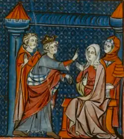 A young crowned man talks with a woman who sits on a throne.