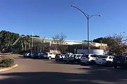 Modern single storey brick building viewed from car park