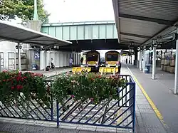 Two 3000 Class units stand at Belfast Great Victoria Street both for Larne and Portadown in 2011
