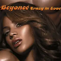 Left side of the face of a brunette black-skin woman with soft makeup. Behind her, the tonic-naked chest of a man is visible. The words "Beyoncé" and "Crazy in Love" are written above her image.