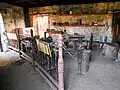 Inside the blacksmith's hut.